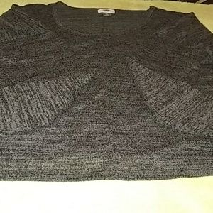A grey and black thin sweater